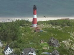 WS AERIAL ZI DS View of light house along coast of Sylt island in Noth Sea / Sylt, Schleswig Holstein Stock Footage