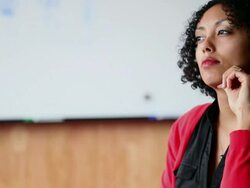 MS TU R/F  Businesswoman sitting at office conference table working on digital tablet/Washington, USA Stock Footage