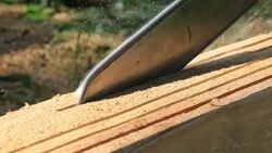 close-up blade of chainsaw cutting wood Stock Footage