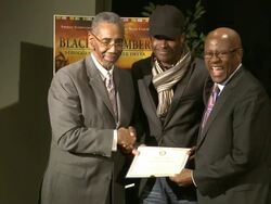 Director Jeta Amata receives recognition from Congressman Bobby L. Rush (L) Stock Footage