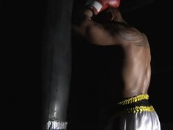 kickboxer hitting a heavy bag Stock Footage