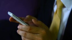 Businessman read on the cellphone Stock Footage
