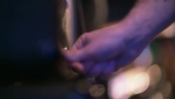 Guitarist toggles on and off switches on amplifier on stage during sound check Stock Footage