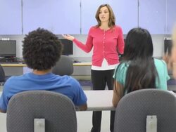 Female Teacher Interacting with Group of Students Stock Footage