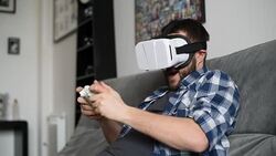 Young adult man and a virtual reality headset. Guy using vr glasses Stock Footage