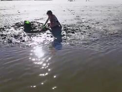 WS TU Shot of young girl building sand castle at beach / St. Simons Island, Georgia, United States Stock Footage