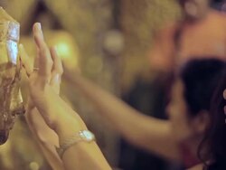 CU Shot of Young woman touching forehead of Buddha statue (seen from side) / Yangon, Yangon Division, Myanmar  Stock Footage