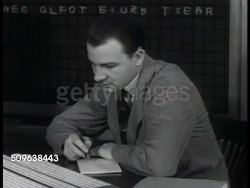 1941: 'THE STUART CASE': FBI Cryptographer reading translation of coded telegram, deciphers code using text based cryptographic template to spell out 'cabin ten sailing twenty third' Instructional Video