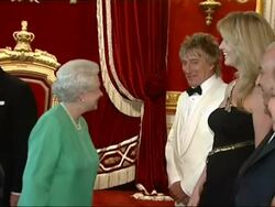 Queen Elizabeth II meets Rod Stewart and his wife, Penny Lancaster Stock Footage