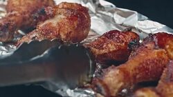 Spicy Chili Chicken Drum Sticks Roasting on s Spit Stock Footage