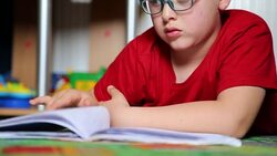 Little boy reading Stock Footage