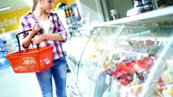 Woman choosing meat products at supermarket. Stock Footage