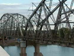 MS Steel bridge collapsing into river  in controlled implosion with  explosives / Bismarck, North Dakota, USA Stock Footage
