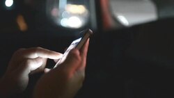 HD:Woman touching smartphone at night time Stock Footage