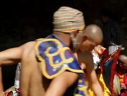 Photographer taking pictures of dancers preparing for a ceremony, Bhutan, Asia Stock Footage