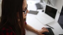 Businesswoman working in a small business looking at screen Stock Footage