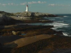 Mid day view of world famous Peggys Cove lighthouse Stock Footage