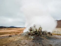 Timelapse of a geothermal vent in Namafjall. Camera dollies to the left and pans to the right. Shot is wide. Stock Footage