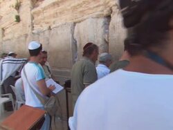 MS POV Male visitors to Wailing Wall socializing and praying  / Jerusalem, Israel Stock Footage