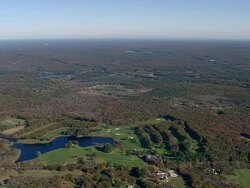 WS AERIAL View of New hampshire surrounded by fall in tree / Massachusetts, United States Stock Footage