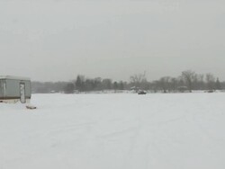 WS PAN View of ice fishing house at Medicine lake during winter / Minneapolis, Minnesota, USA Stock Footage