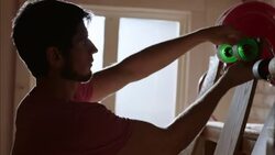 Shop worker ties price tag to custom skateboard Stock Footage