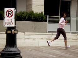 WS TU TS Woman jogging and checking sport band / Portland, OR, USA Stock Footage
