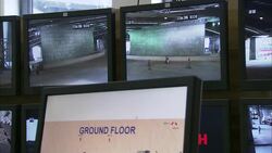 Surveillance monitors display activity on a city street. Stock Footage