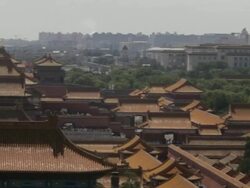 WS PAN Forbidden City's rooftops, with National Grand Theater in background / Beijing, China Stock Footage