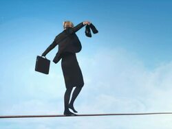 Business woman doing balancing act Stock Footage
