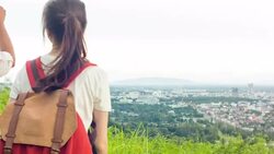 HD DOLLY : Hikers reach mountain peak and take a photo with smart phone Stock Footage