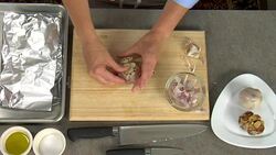 Overhead preparing garlic for baking. Stock Footage
