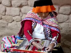 MS Local sitting woman in traditional clothes weaving yarn / Sacred Valley, Peru  Stock Footage