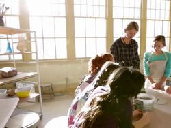Students watching teacher explain glazing techniques Stock Footage