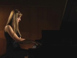 HD DOLLY: Woman plays piano on stage Stock Footage