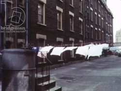 Somewhere Decent to Live 1967 part 4 - kids from council estates playing in streets, shots of council housing Stock Footage