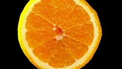 Healthy orange fruit slowly rotating with black background Stock Footage