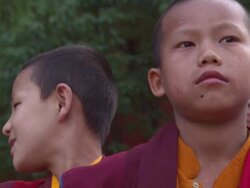 CU Boy monk sniffling and standing with authority / Kathmandu, Central Region,Nepal Stock Footage