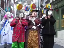 MS Shot of masked people walking on street and celebrating in Basel Carnival (Basler Fasnacht) / Basel, Switzerland Stock Footage