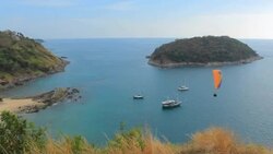 Extreme Sports - Paragliding over the Sea clear blue sky Stock Footage