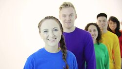 Gay pride group standing in unity wearing colored shirts Stock Footage