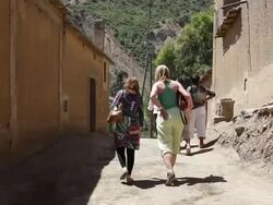 Tourists exploring a traditional Berber village in the Ourika Valley, Morocco, Africa  Stock Footage