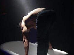 MS TS Shot of Hunky topless man performing gymnastic display in bath / London, United Kingdom Stock Footage