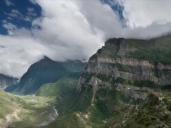 T/L cloud over Ghyaru the Rock, Himalayas Stock Footage