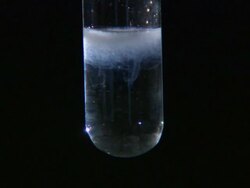 Lead (II) bromide precipitate, formed as potassium bromide is dripped into lead (II) nitrate solution Stock Footage