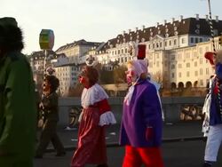 MS Shot of people with mask and dressing up celebrating Basler Fasnacht (Basel Carnival) on street / Basel, Switzerland Stock Footage