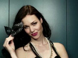 Young woman holding masquerade mask Stock Footage