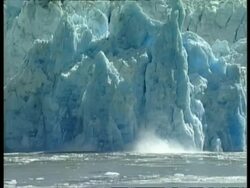 MWA large sheet of ice from glacier collapsing into sea, Arctic circle Stock Footage