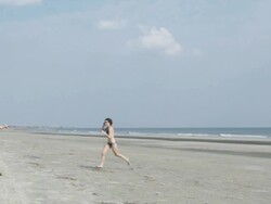 WS SLO MO Young couple flying kite at beach / Isle of Palms, South Carolina, USA Stock Footage