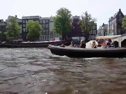 WS POV View of boat traveling through canal / Amsterdam, The Netherlands, Holland Stock Footage